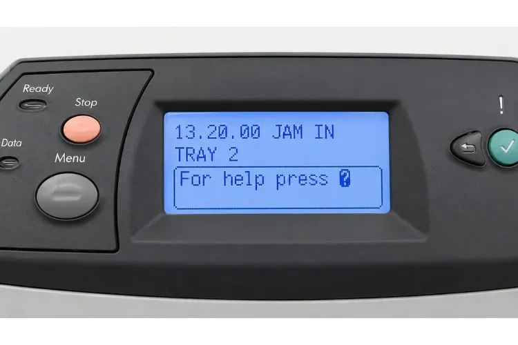 Office printer control panel showing a 13.XX paper jam error code with the attention light on